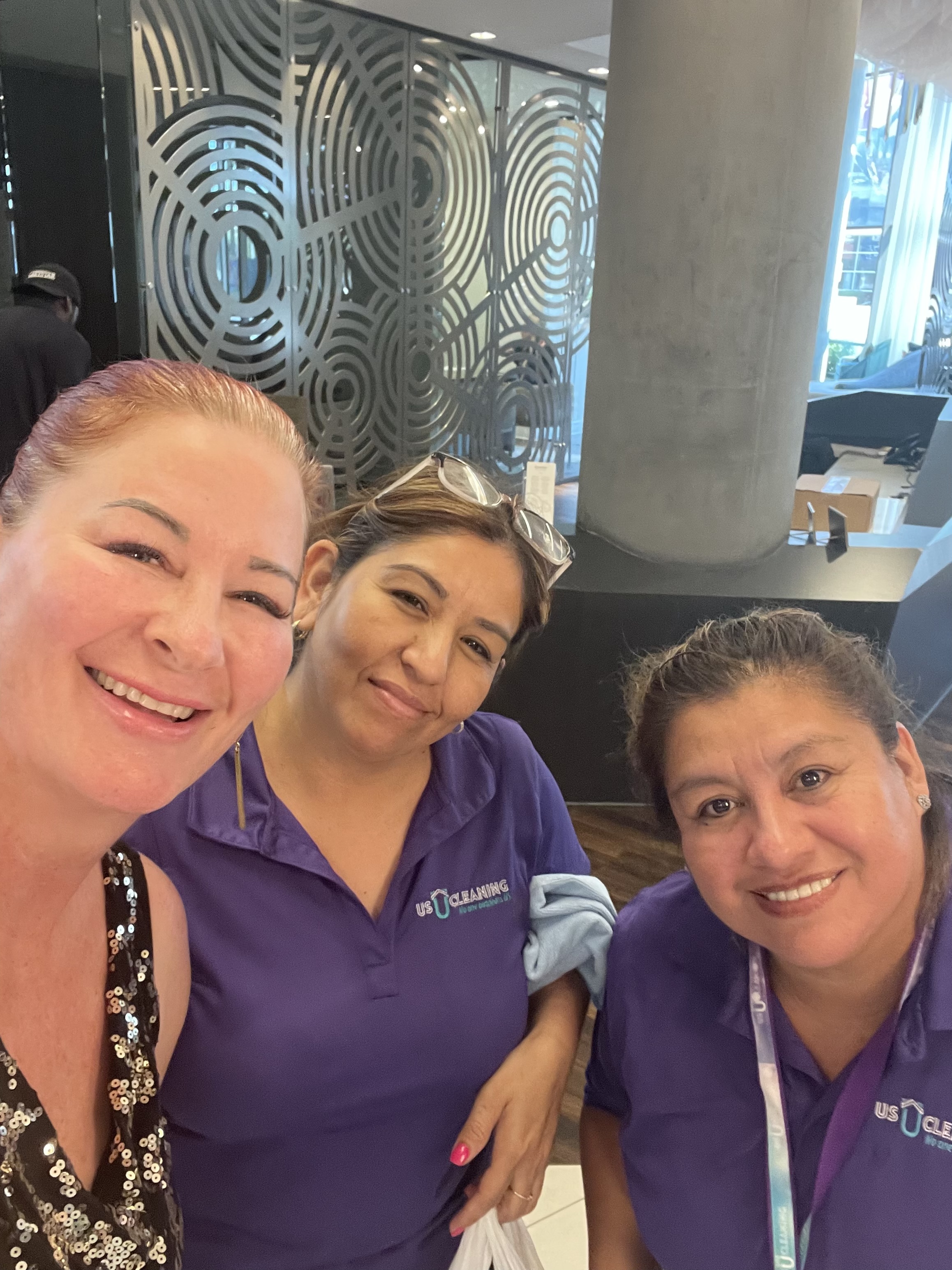 Us Cleaning Solutions team members smiling