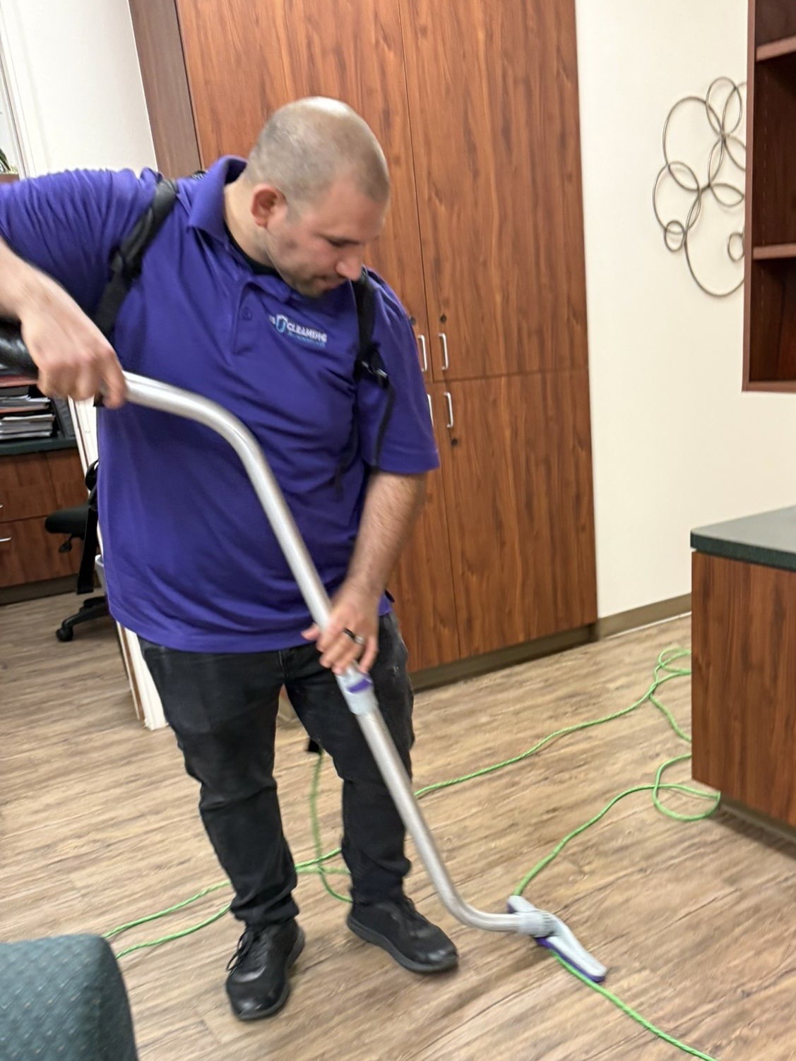 Us Cleaning Solutions team vacuuming a corporate office floor in Scottsdale, Arizona
